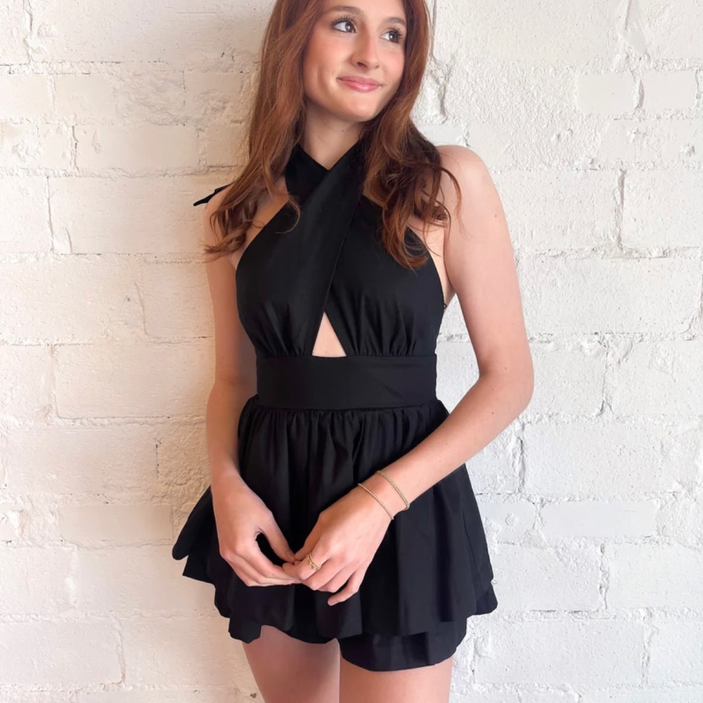 Effortlessly chic and versatile, strapless black romper